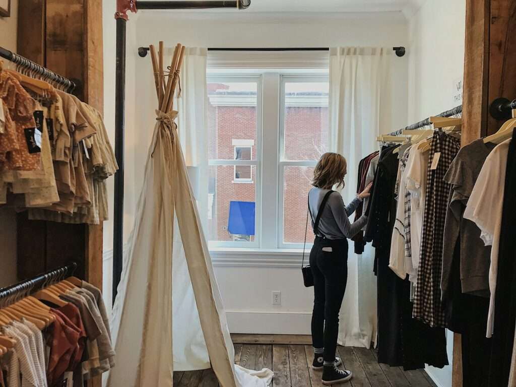 Woman standing selecting clothes