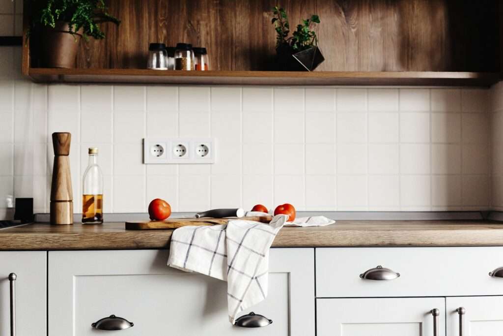 Wooden board with knife and a towel image