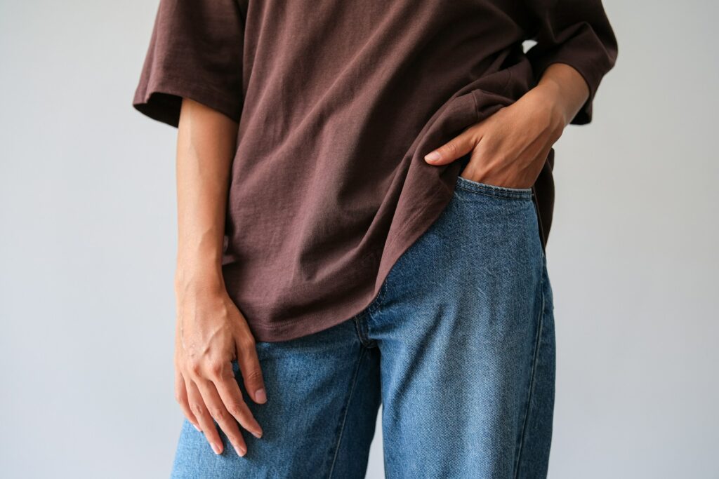 A woman with her hands on her pocket image