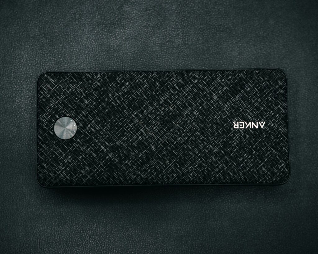 A black speaker sitting on top of a table image