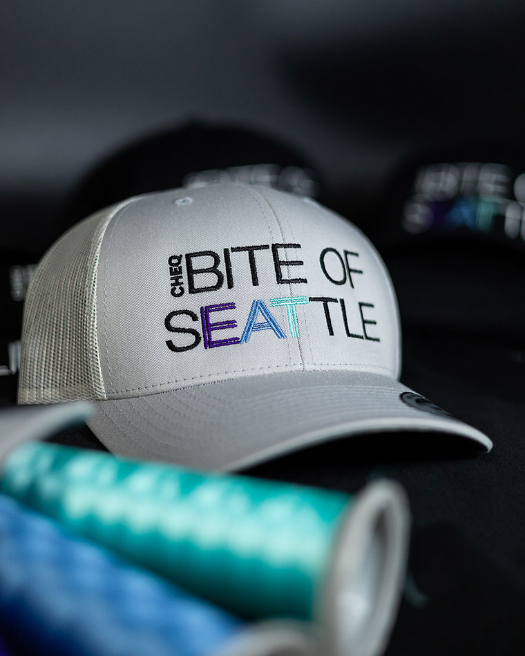 logounlimited-biteofseattlehat-merchmadebetter-custommerch-screenprint-embroidery