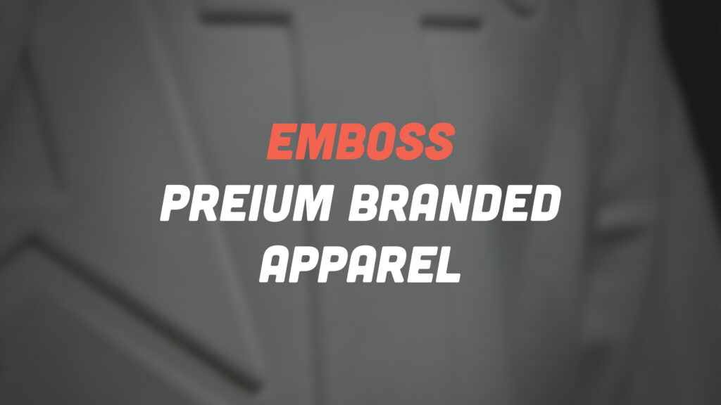 Red 'EMBOSS' heading above white 'PREMIUM BRANDED APPAREL' text on a blurred gray background, branding banner.