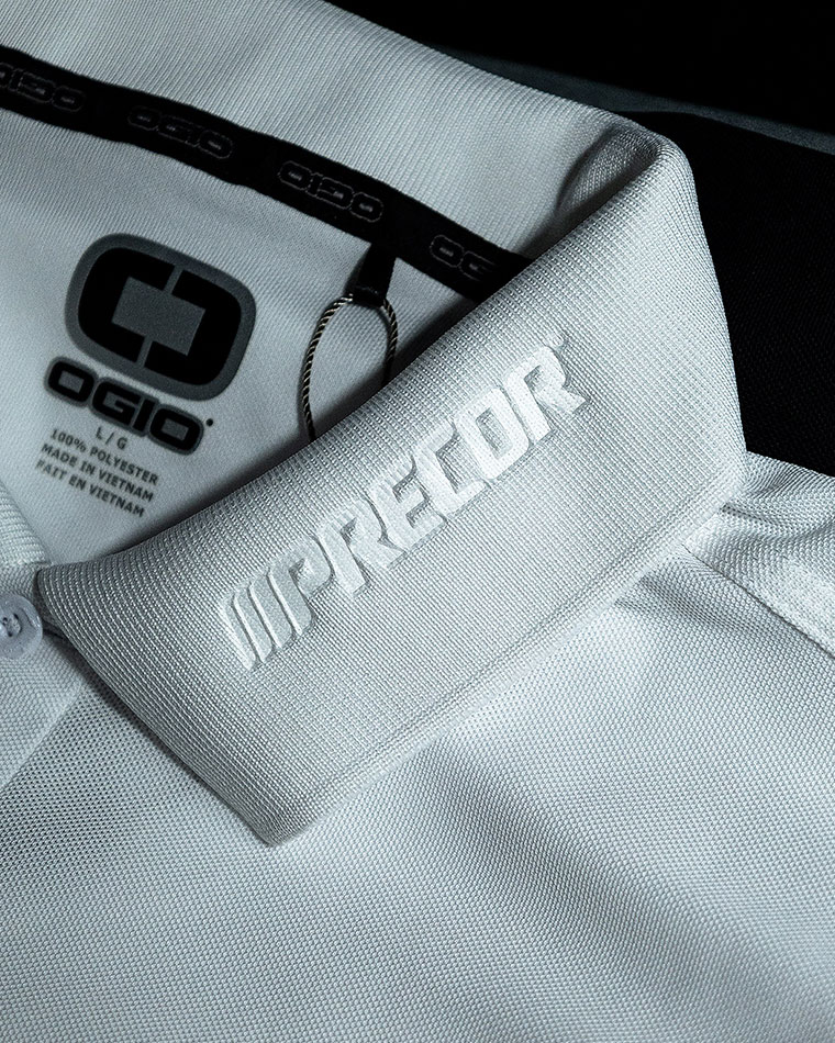Close-up of a white polo shirt collar with embossed 'WORKFORCE' lettering and the OGIO logo visible inside the collar area.
