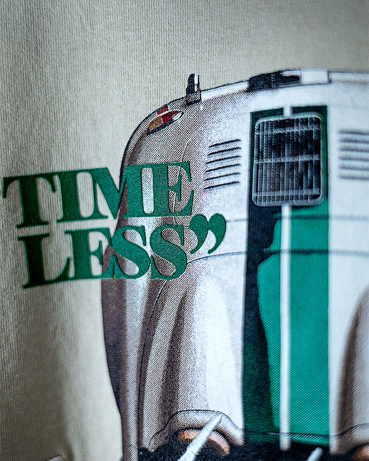 Close-up of a vintage iron with a green 'TIMELESS' overlay text across it.